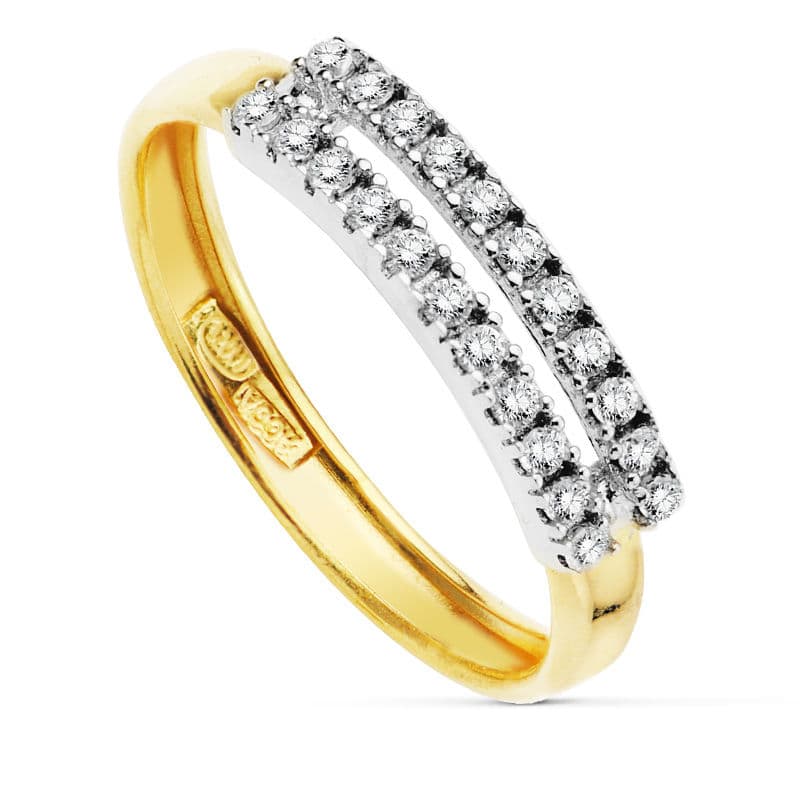 Tvåfärgad zirkonring i 18K guld.