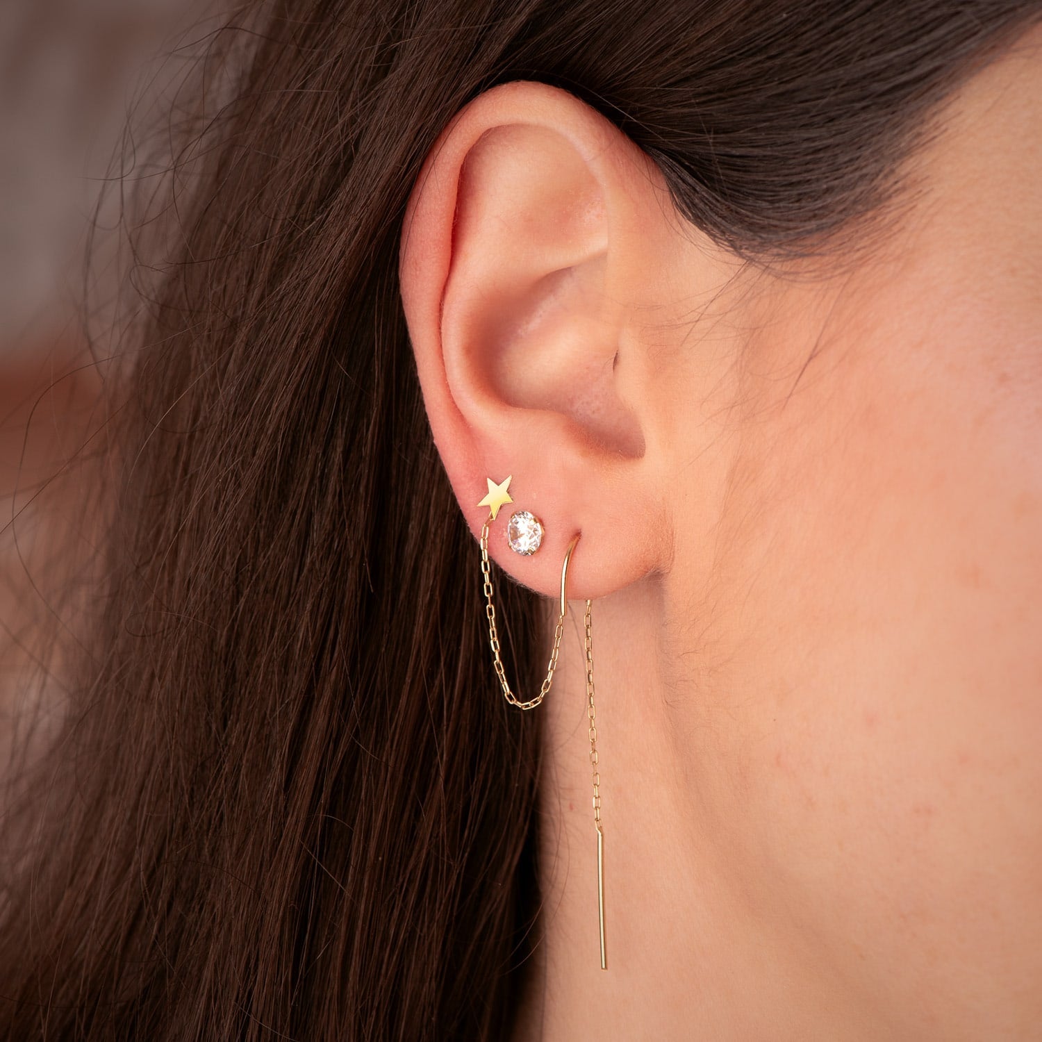Catena per piercing in oro giallo 18 carati e stella per 2 fori Lunghezza: 85 mm (pezzo)