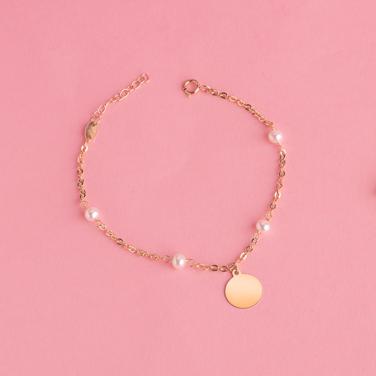 Pulseira em ouro amarelo 18K com contas de 3,5 mm e placa redonda de 10 mm. Comprimento 15 2 cm